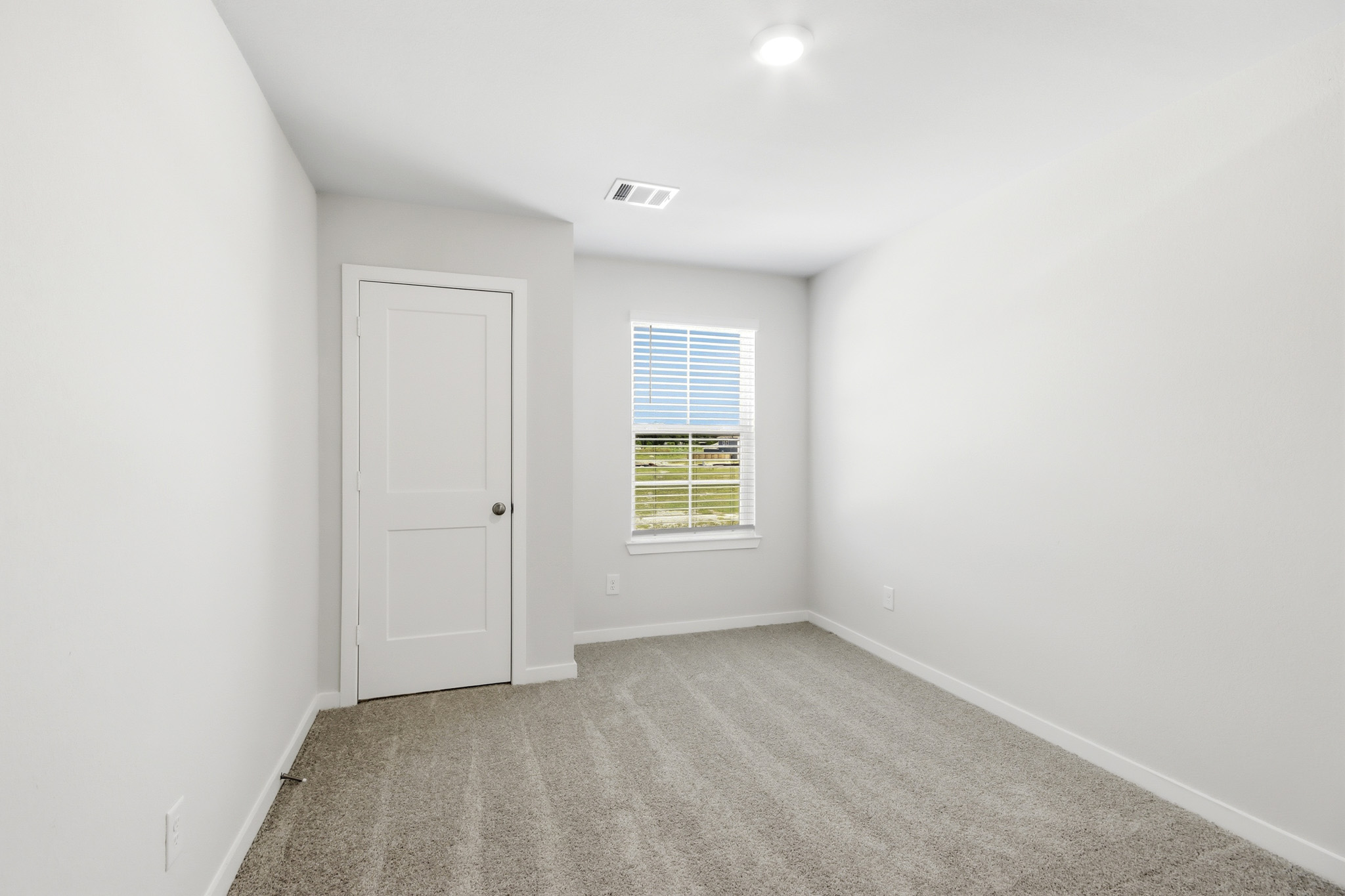 A room with a door and a window.