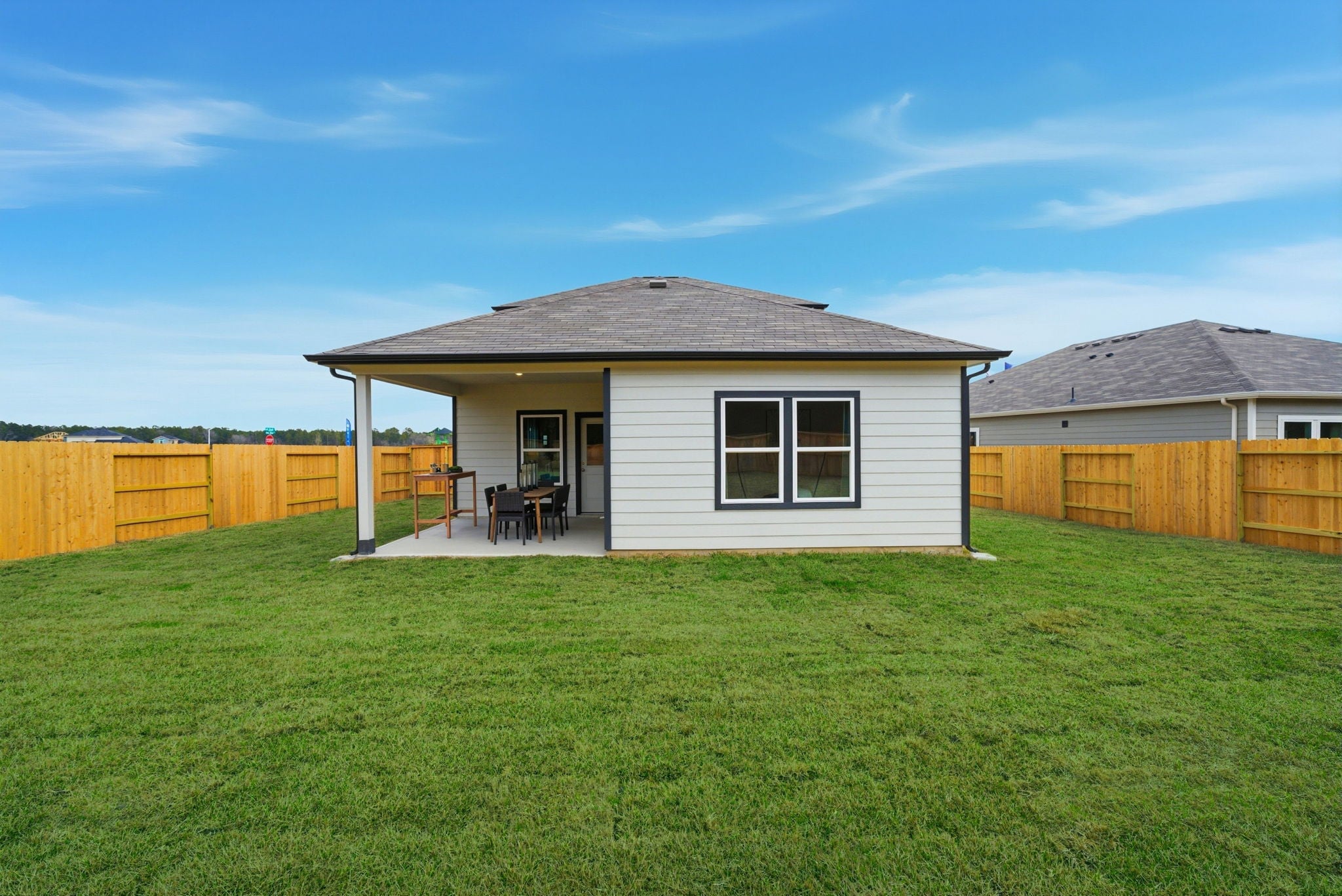 A house with a fence around it.