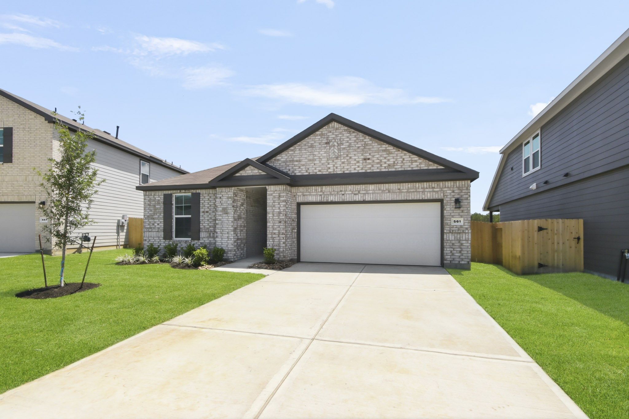 A driveway leading to a house.