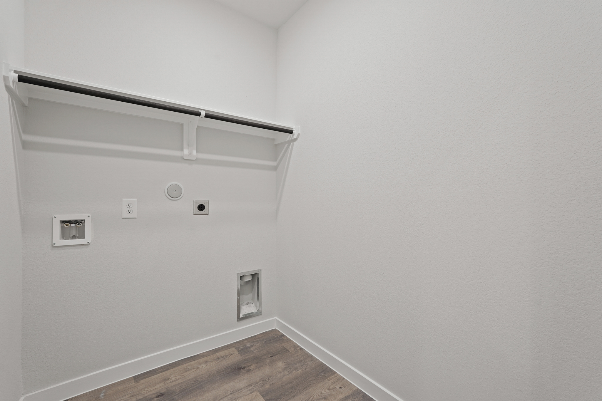 A white wall with a light on it.