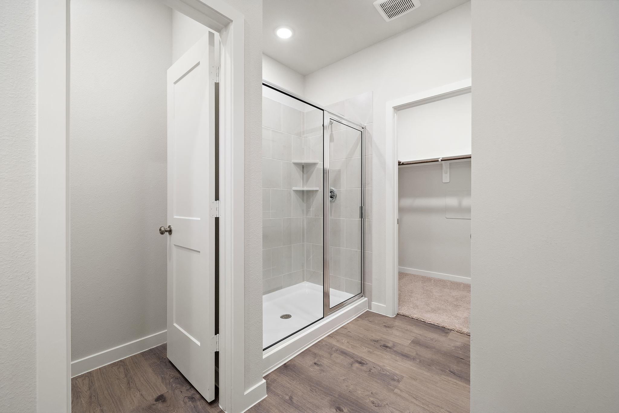A bathroom with a glass shower.