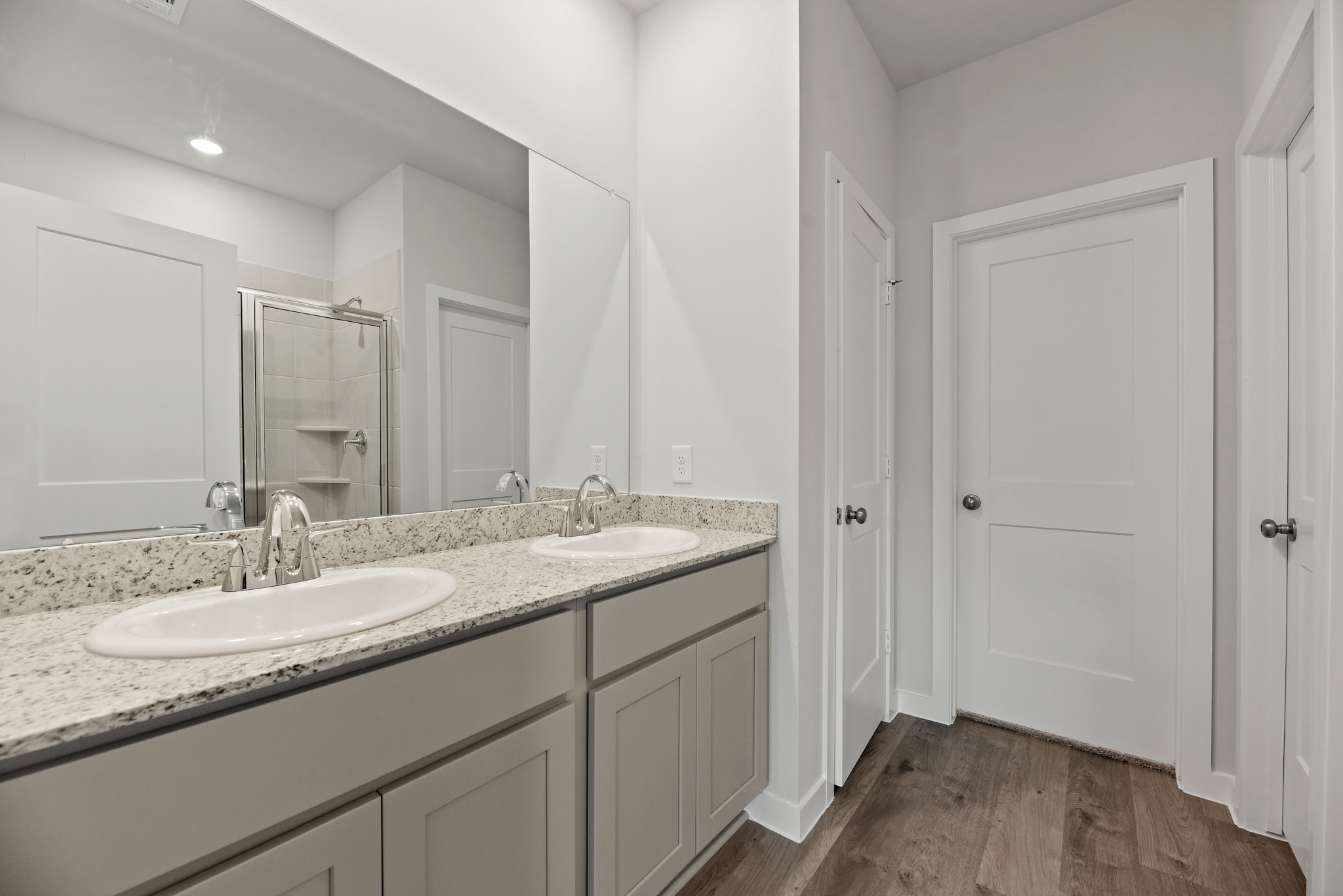 A bathroom with a marble countertop.