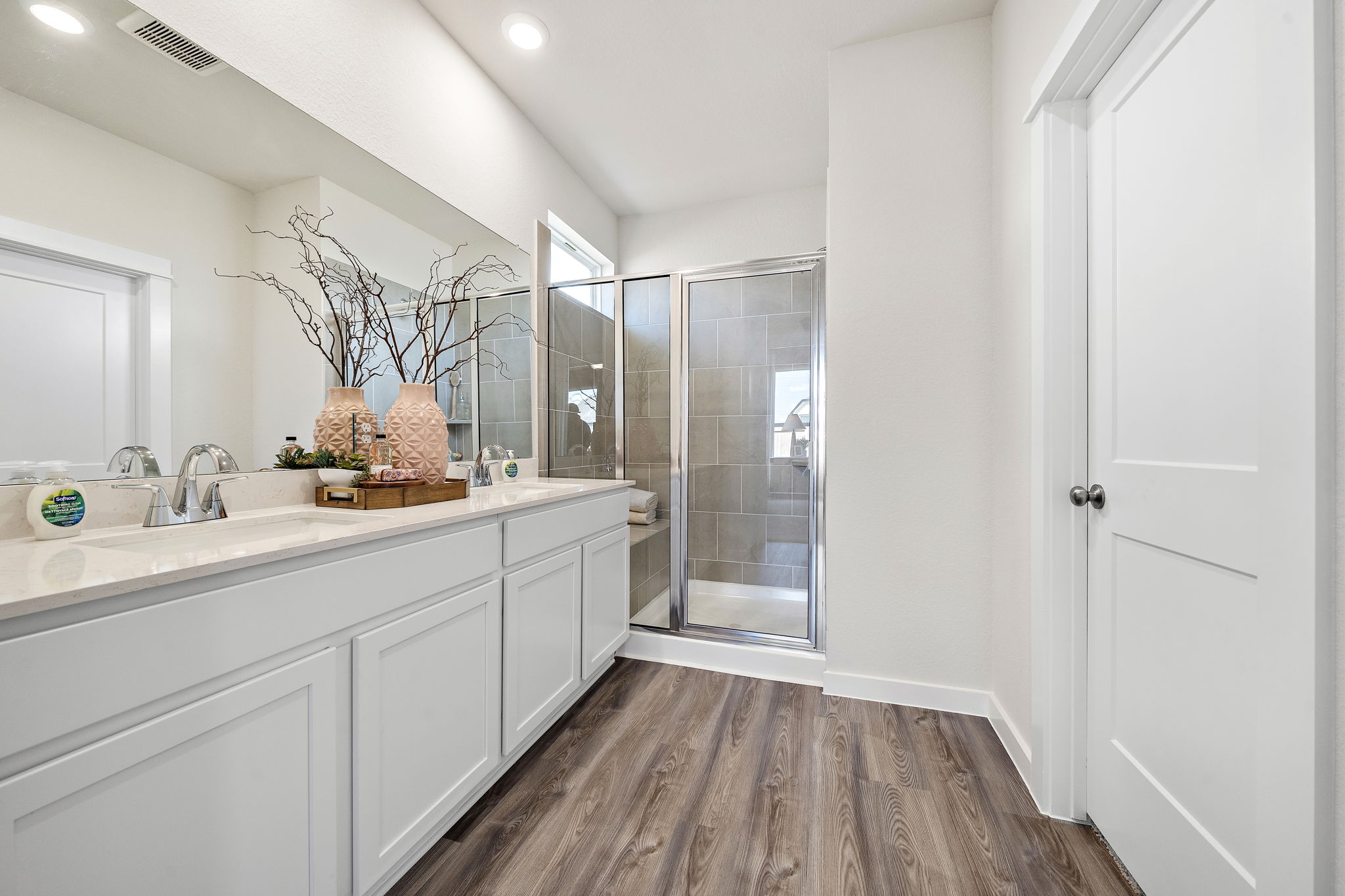 A bathroom with a glass shower.