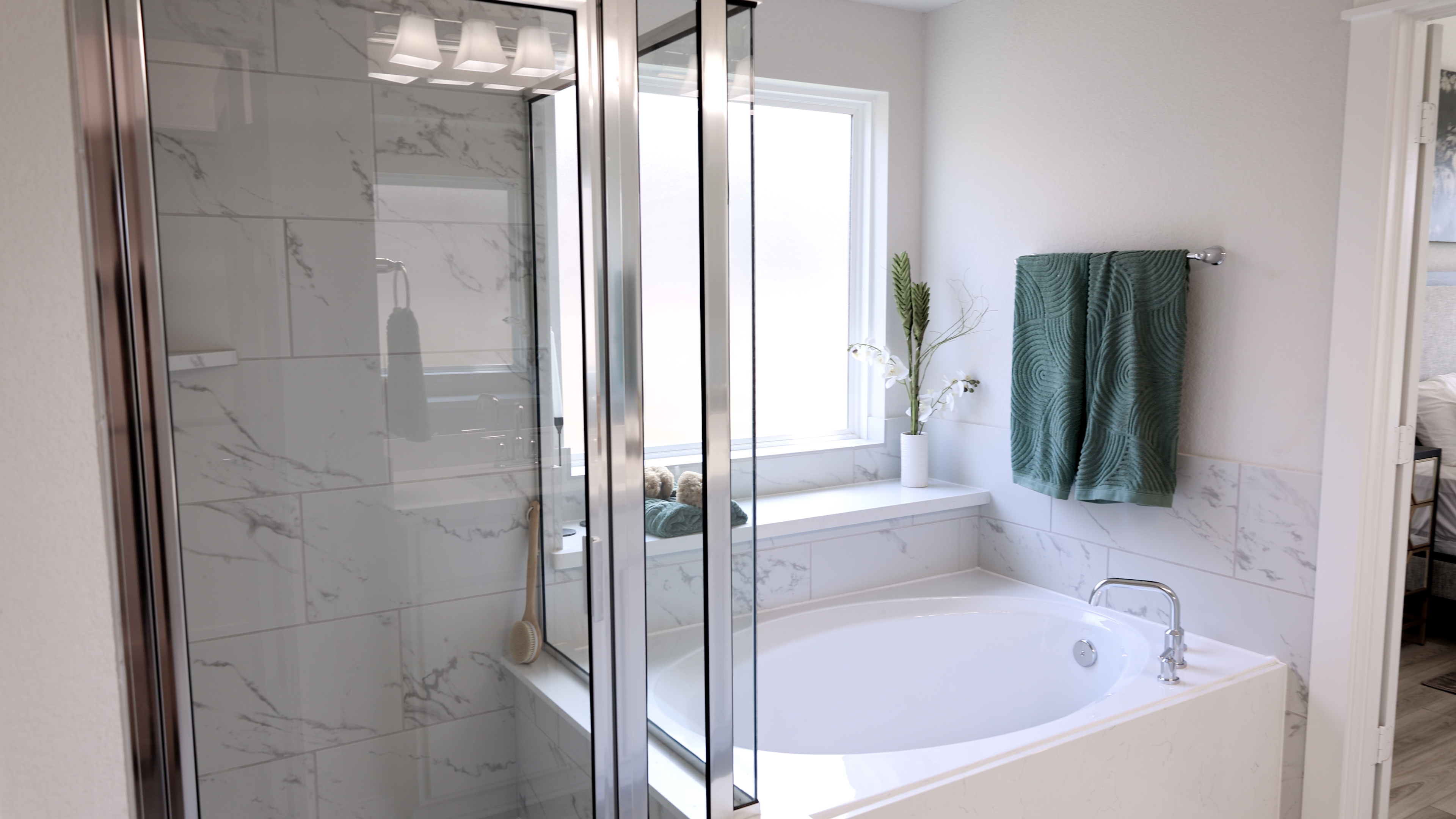 A bathroom with a bathtub and shower.