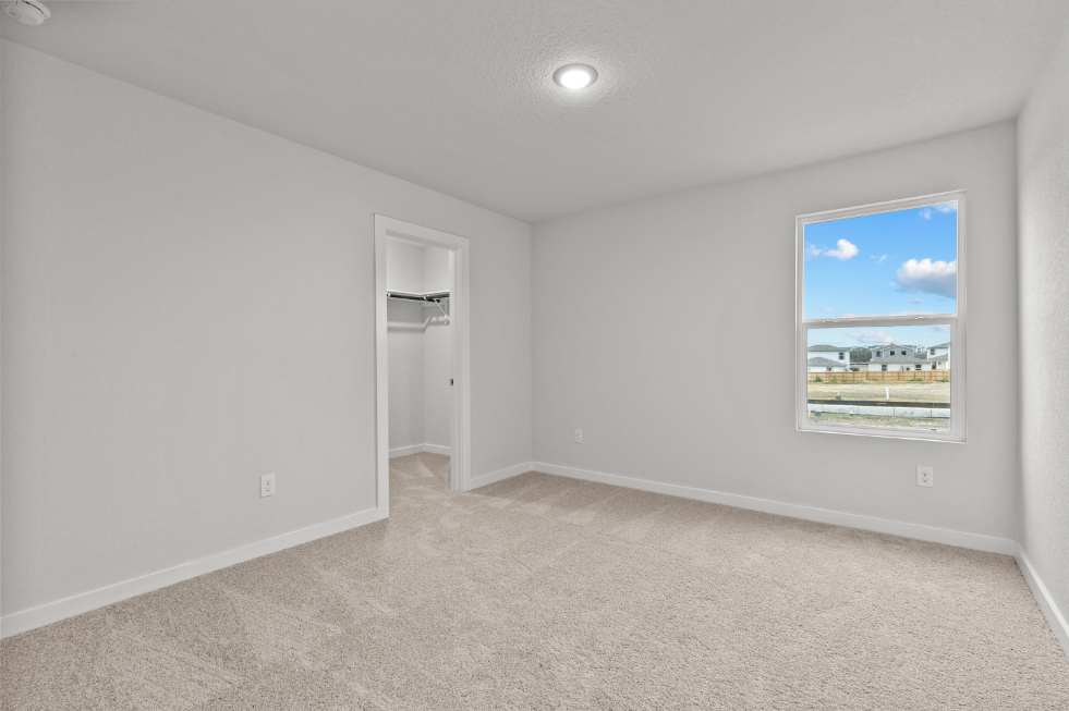 A room with a painting on the wall.