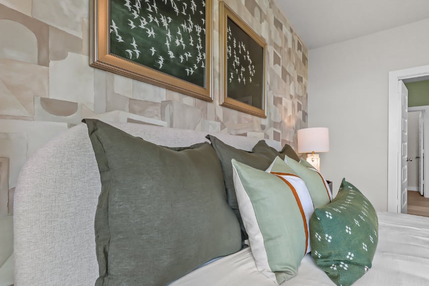 A couch with pillows.