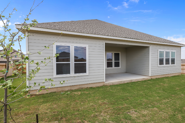 A house with a grass yard.