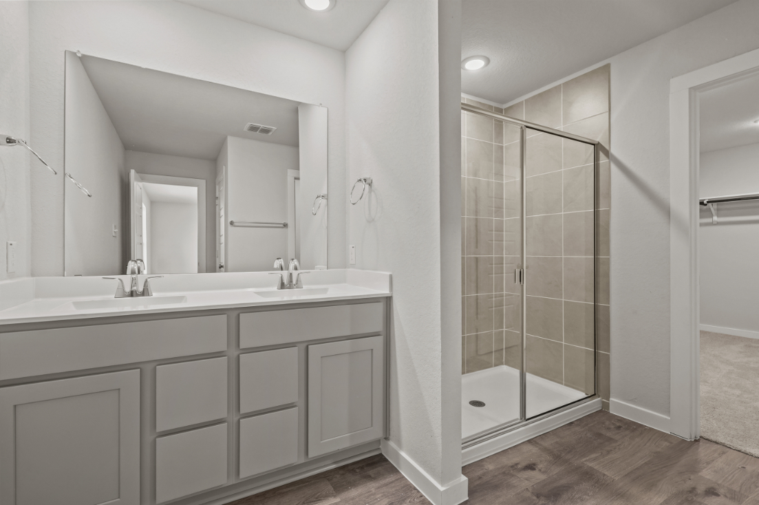 A bathroom with a glass shower.