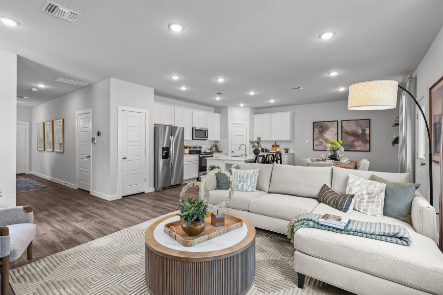 A living room with a couch and a table.