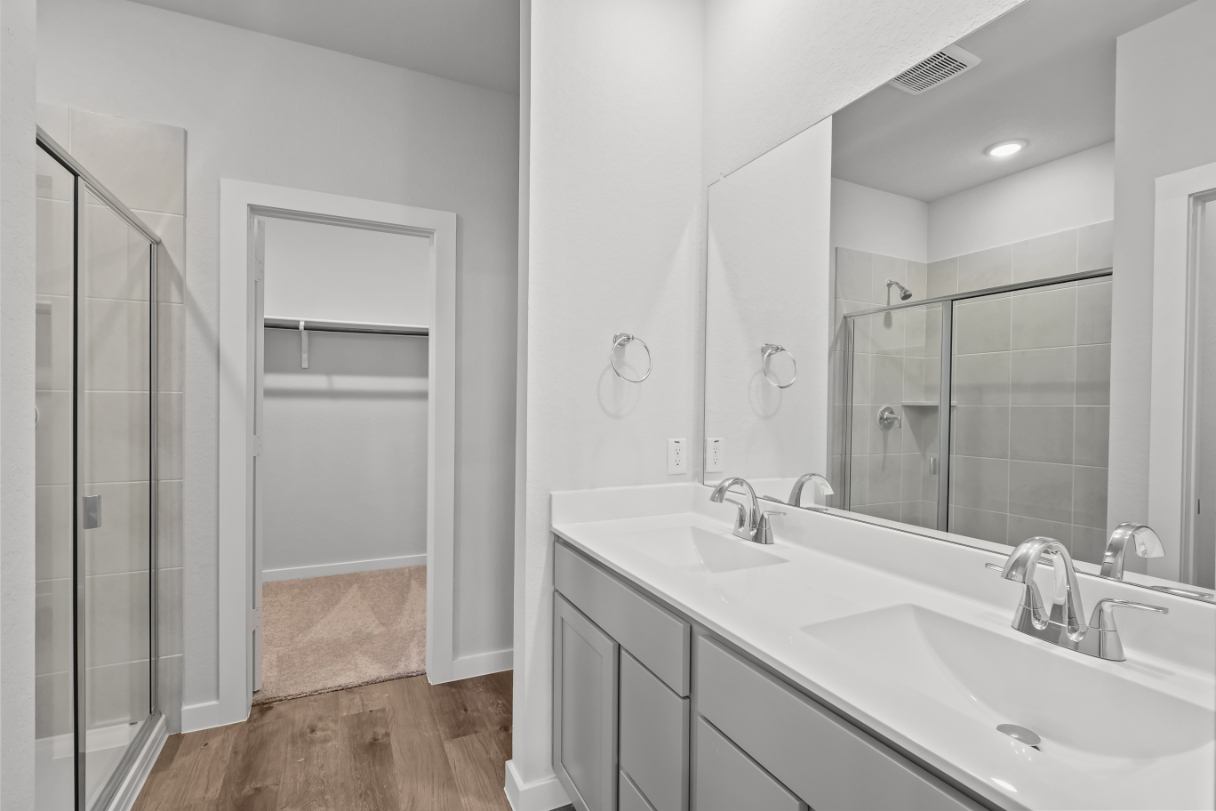 A bathroom with a glass shower.