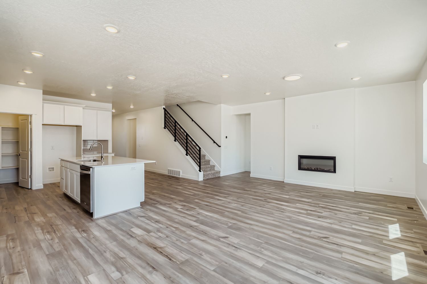 A large kitchen with white cabinets.