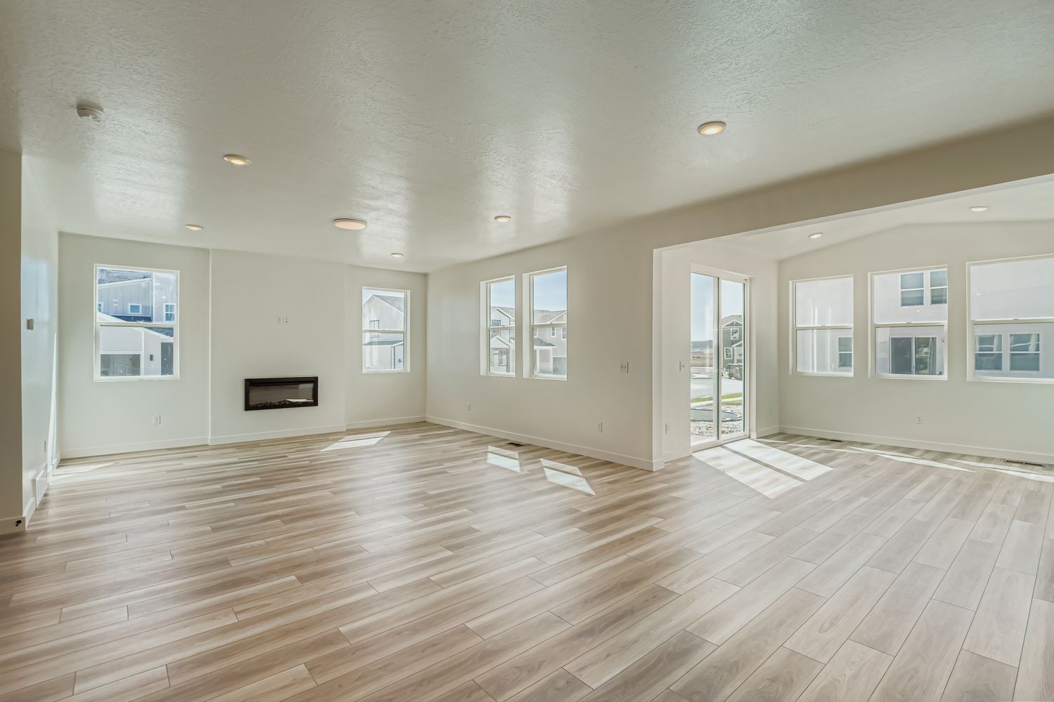 A large empty room with white walls.