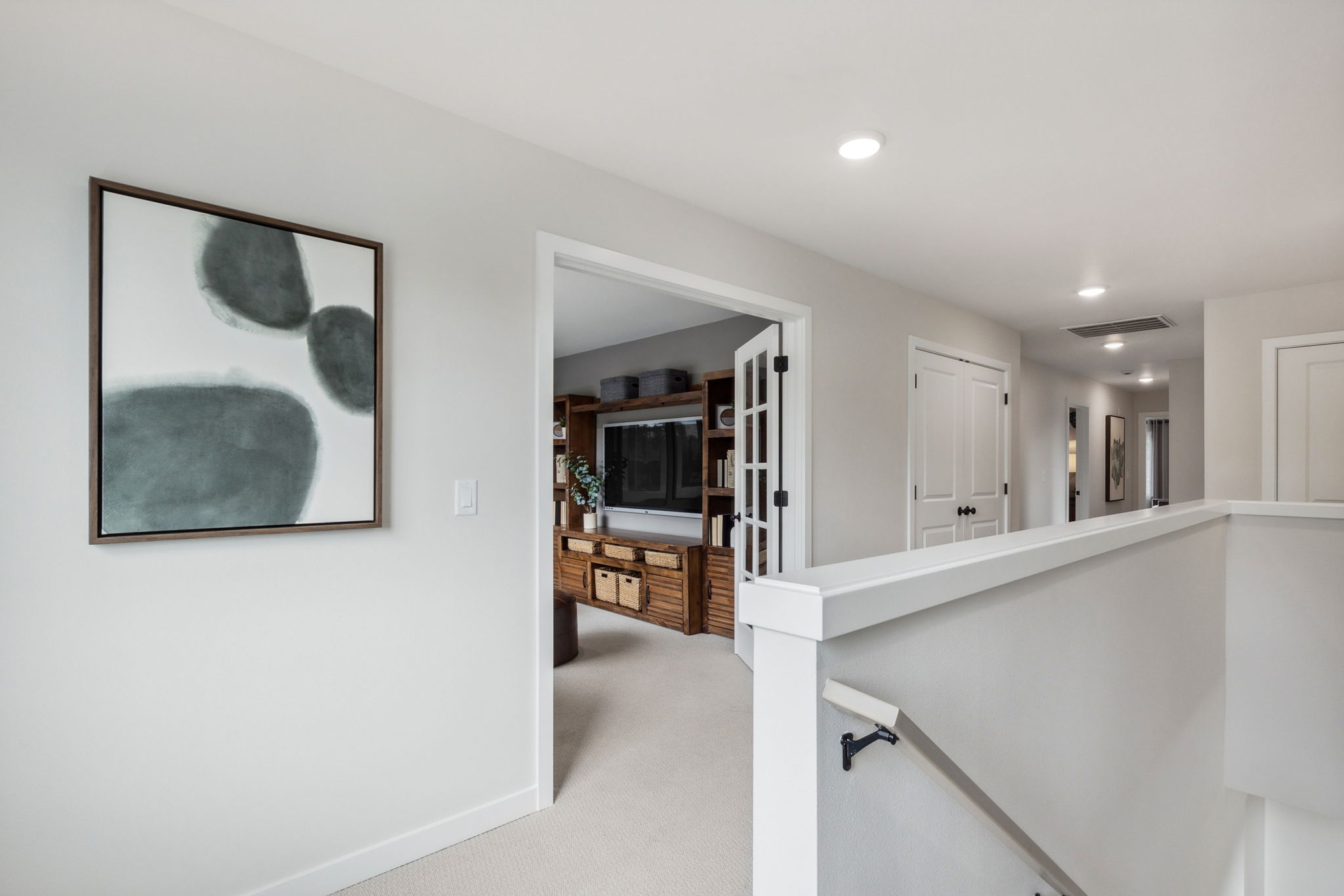 A white room with a fireplace.