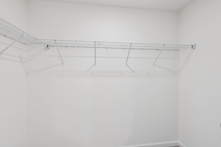 A white ceiling with a vent.