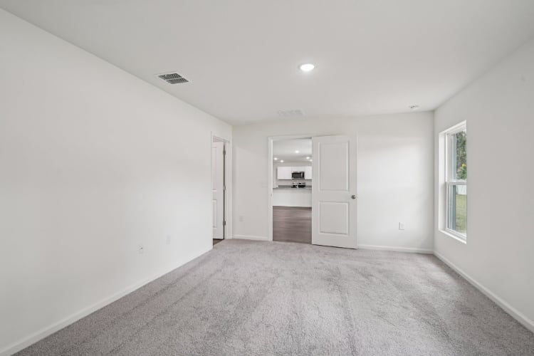 A hallway with white walls.