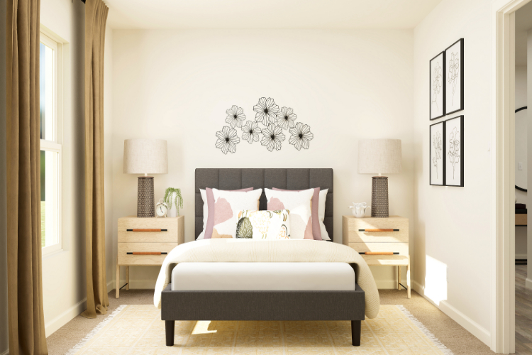 A bedroom with a bed and lamps.