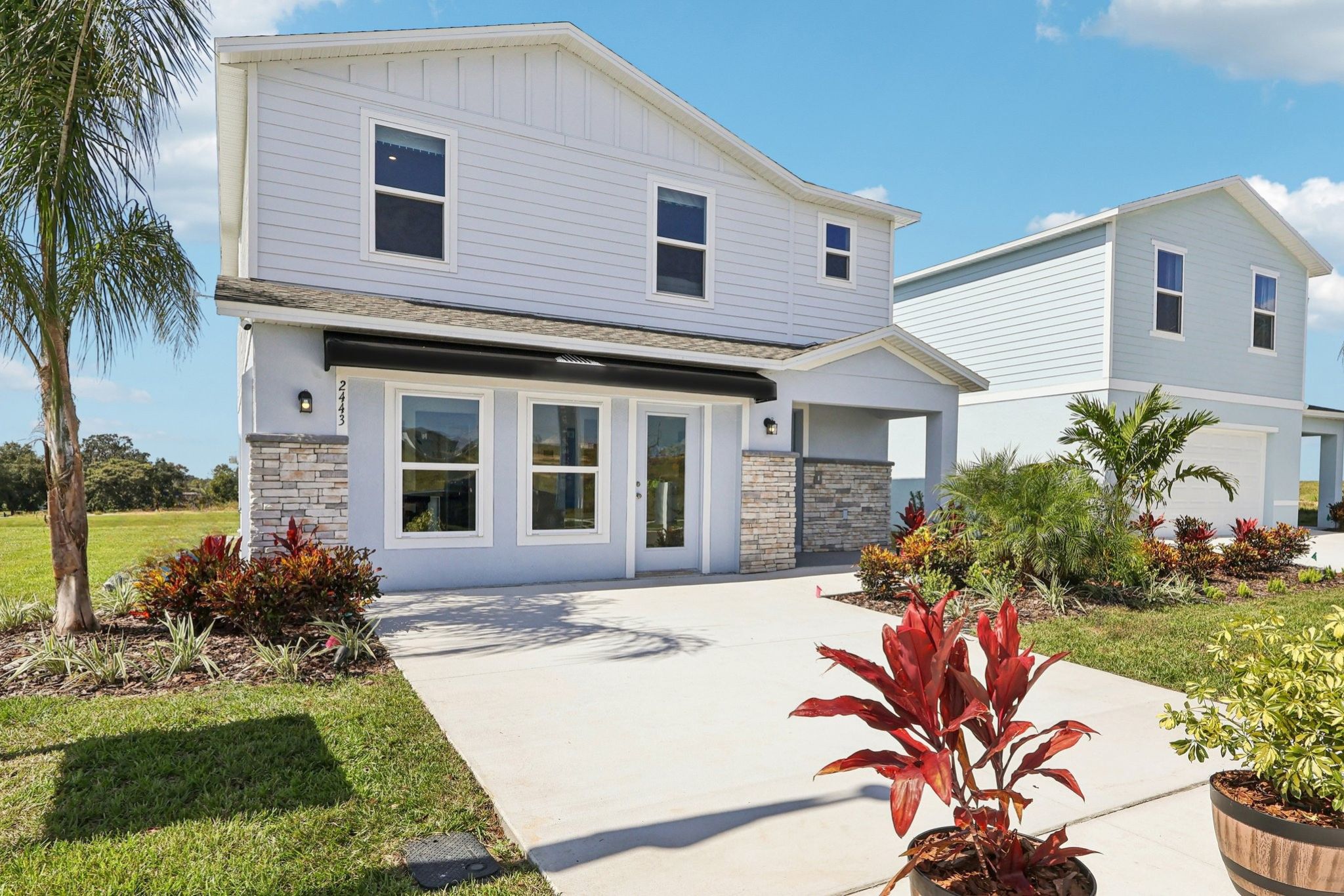A white house with a driveway.