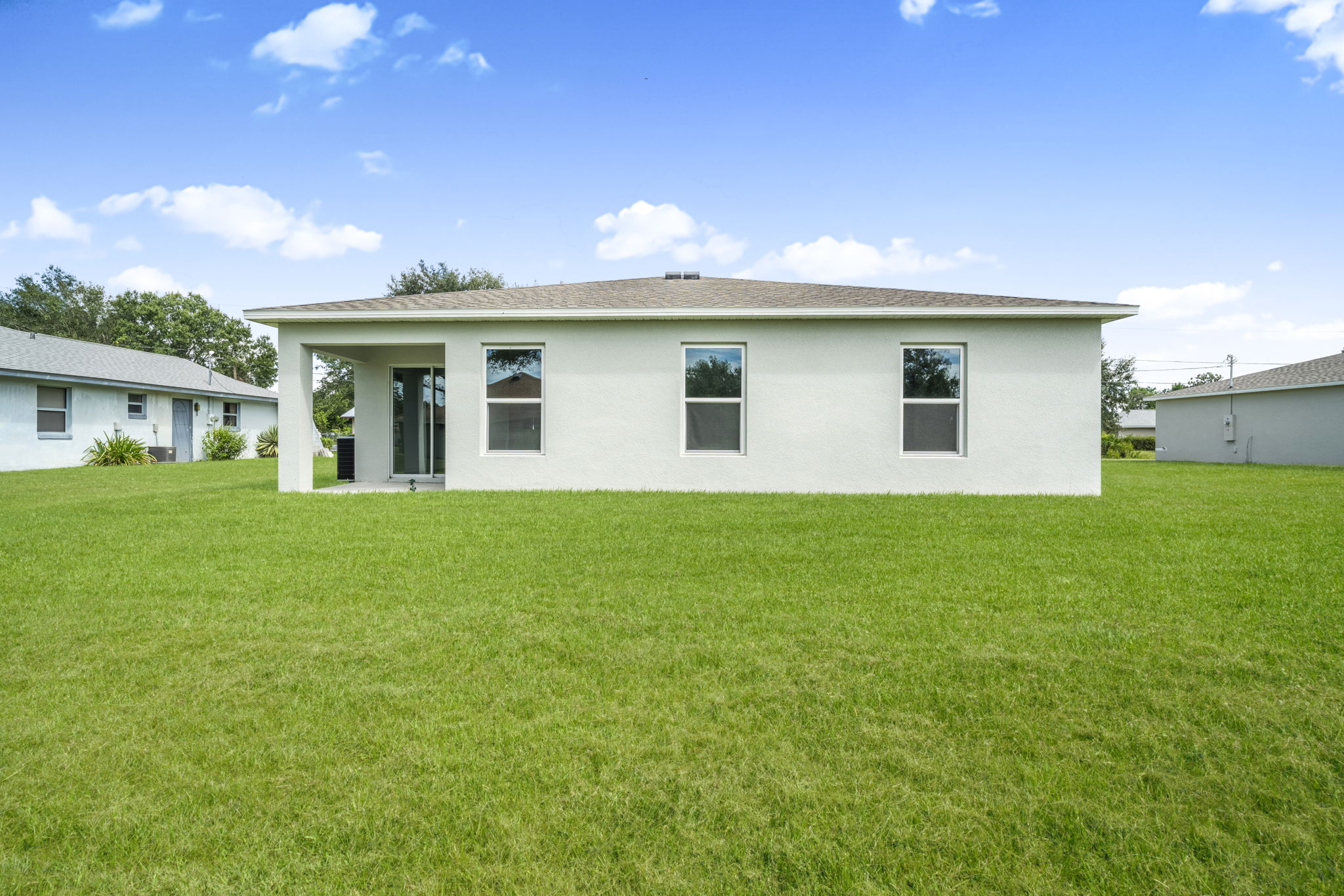 A house with a grass yard.