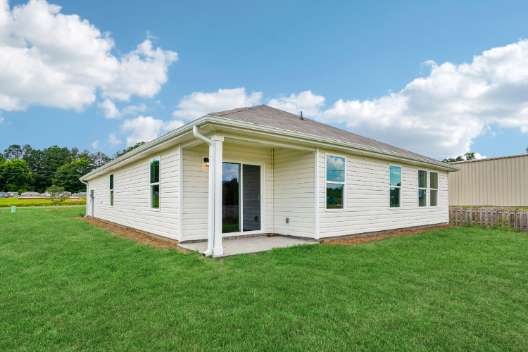 A house with a grass yard.