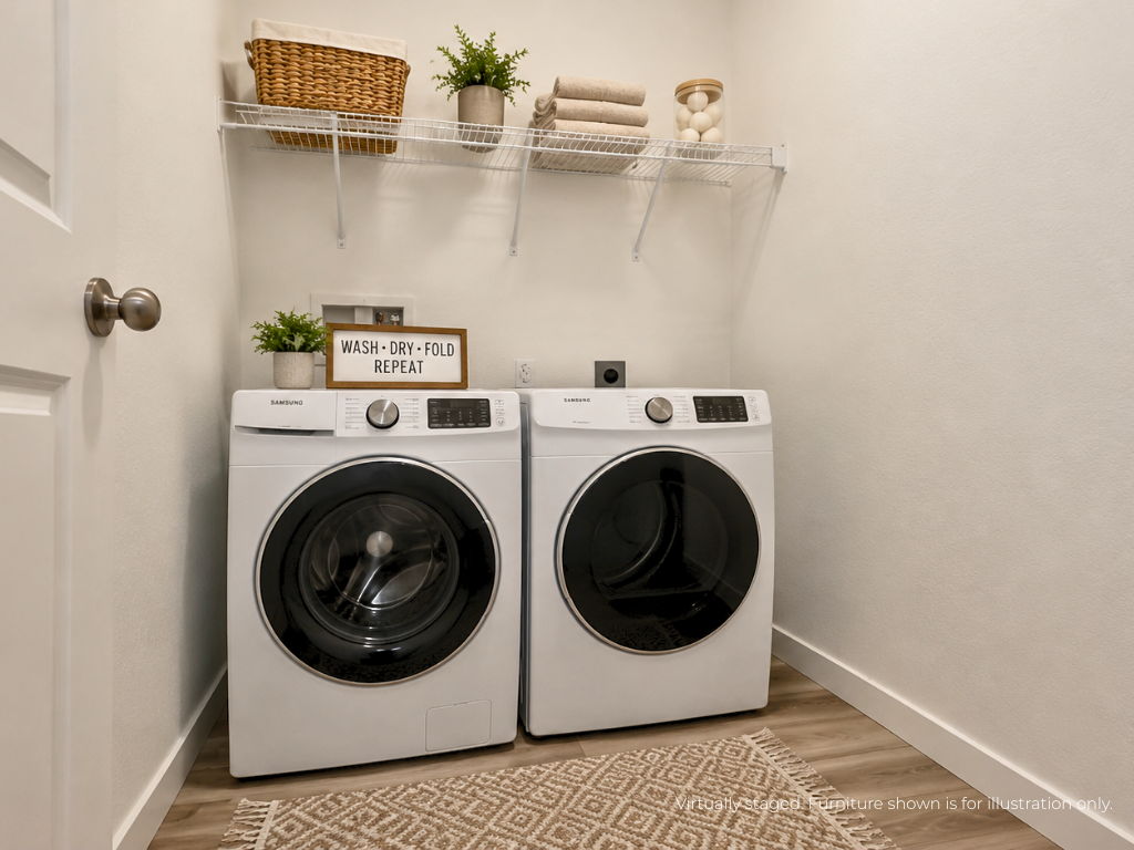 A washing machine and dryer in a room.