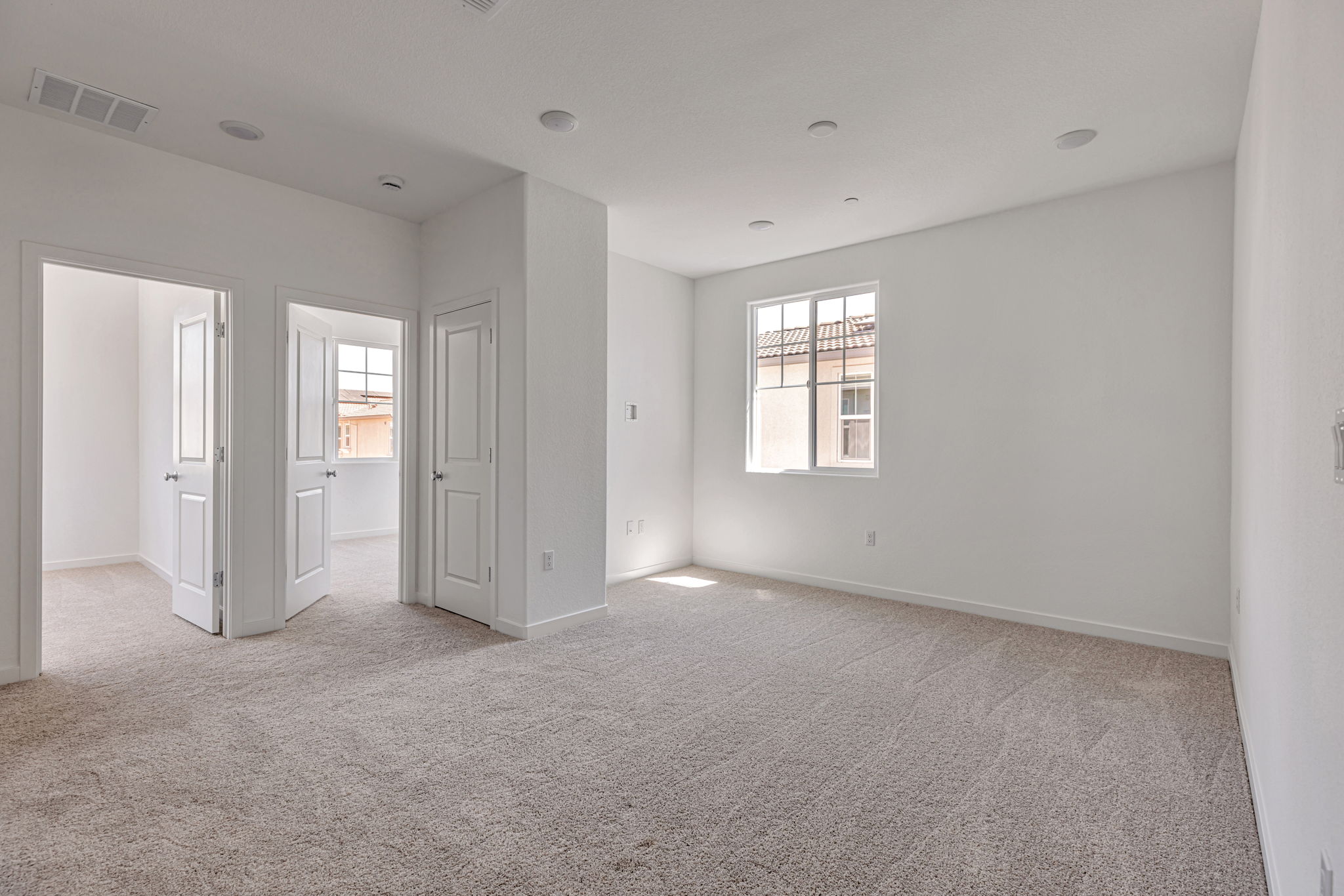 A room with white walls and windows.
