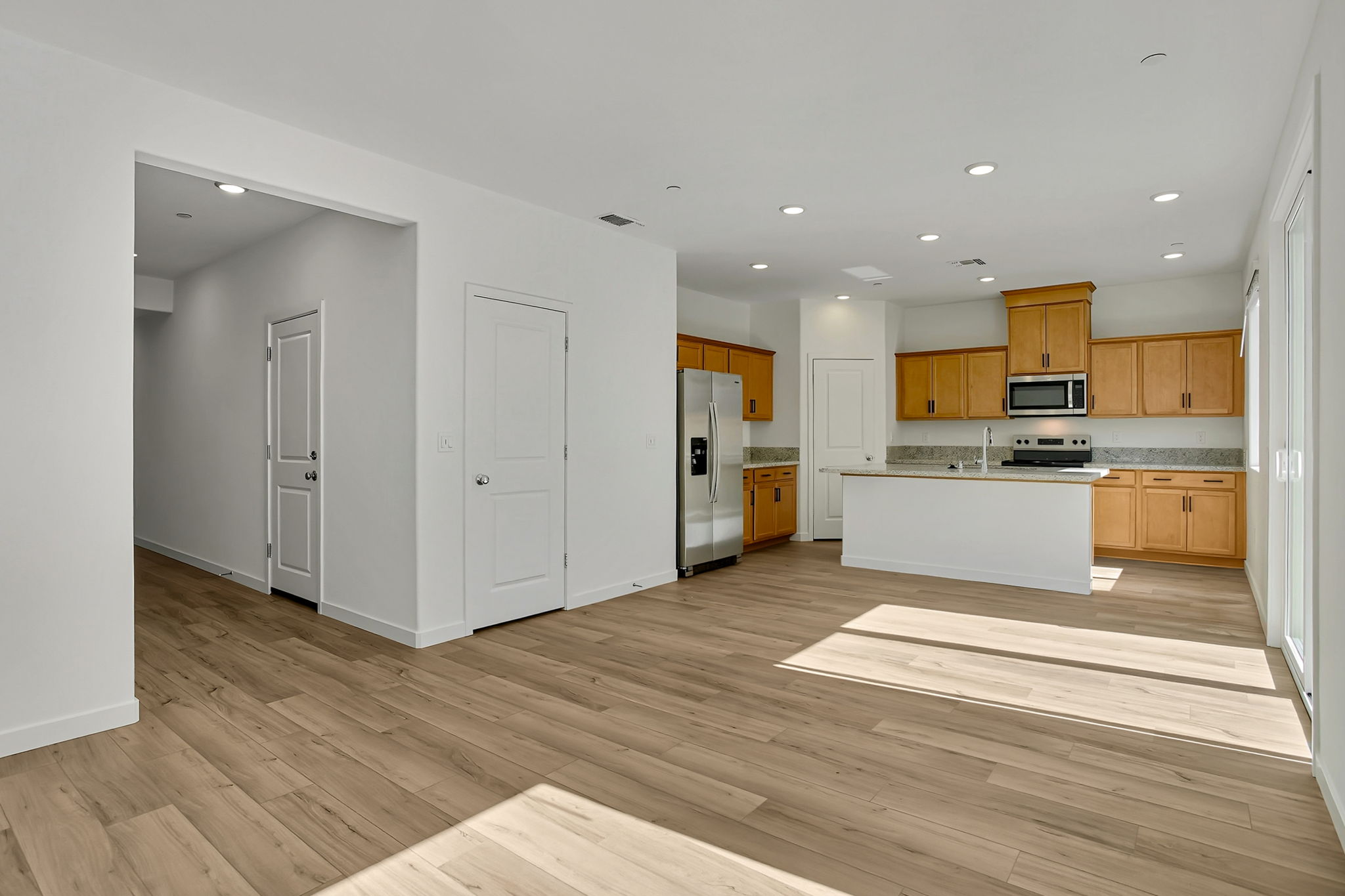 A kitchen with wooden floors.